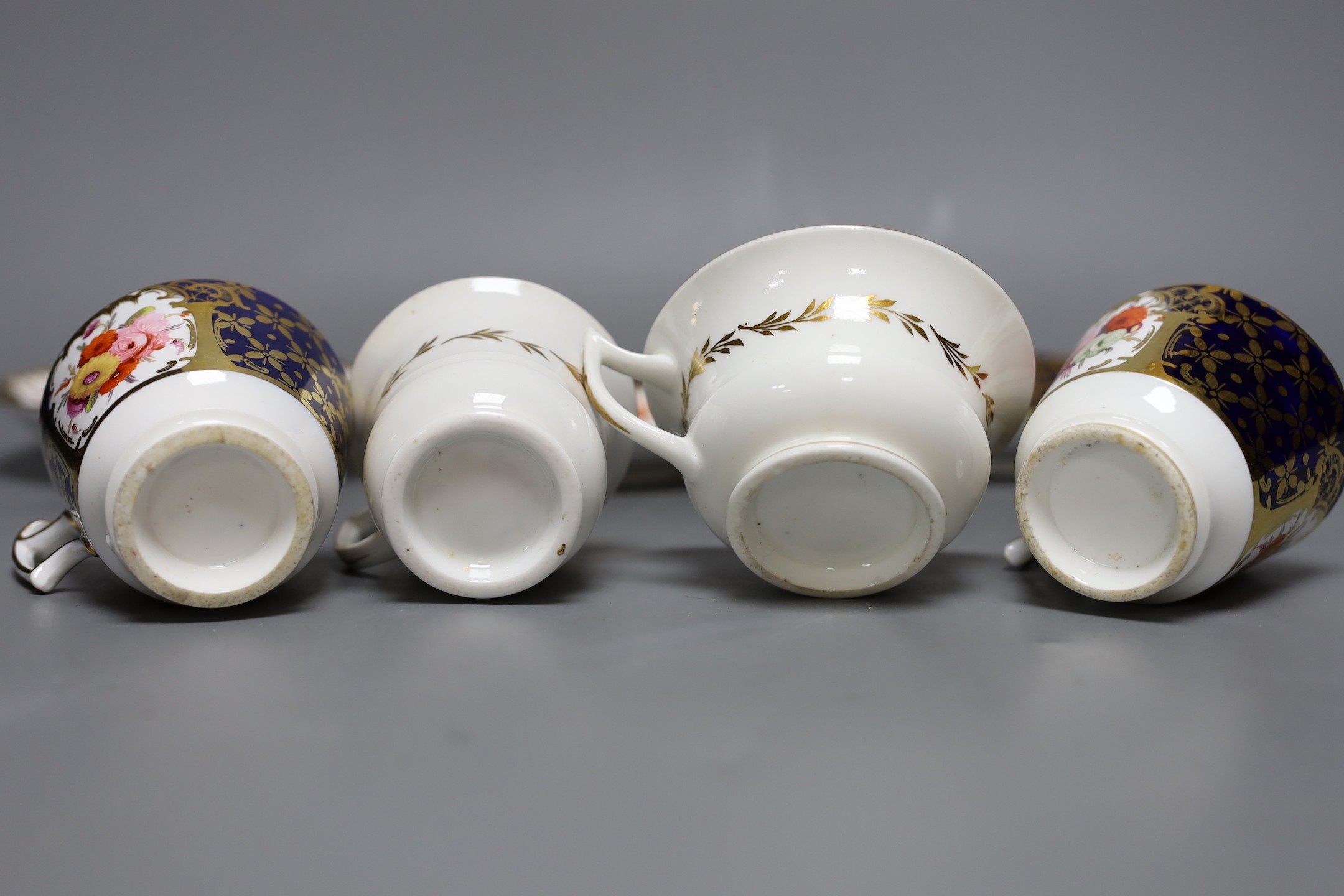 An early 19th century pair of Coalport coffee cups and saucer painted with pattern 793 and a New Hall Coffee cup, teacup and saucer, See M. Messanger, Coalport, page 168, plate 114 for pattern 793, New hall cup 6.5 cms h